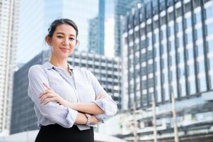 Young business woman with arms crossed photo