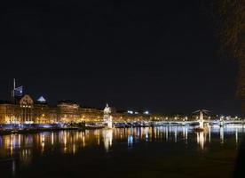 Central old town Lyon city and Rhone river side view at night in France photo