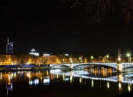 Central old town Lyon city and Rhone river side view at night in France photo