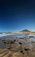 La Tejita kite surfing beach and Montana Roja landmark in south Tenerife Spain photo