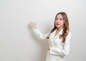 Portrait beautiful business woman with hand presenting or pointing photo