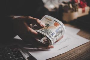 Hands of business woman holding dollar photo