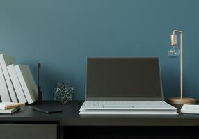 A working room with a laptop with a lamp placed on the table. photo