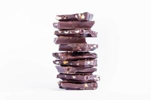 Chocolate bar stack on white background photo