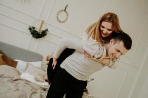 Young couple in love, smiling and fooling around photo