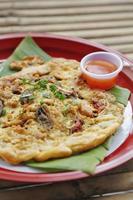 Oyster omelette and spicy sauce in Chinese style photo