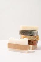 Stack of hand made soap and craft band for mock up design on white photo