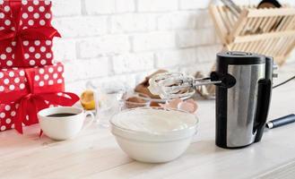 Whipped cream of egg whites with perfect peaks in a glass bowl photo