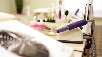 Professional equipment on the background of a blurry nail salon. photo