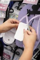 Young woman buying shoes photo