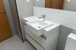 White marble sink with modern overlay basin photo