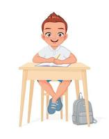 Happy school boy sitting at desk cartoon vector illustration