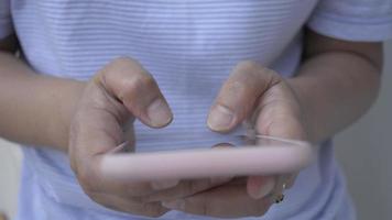 Woman texting message on mobile phone for chatting on social online video