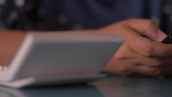 Businesswoman chatting with smartphone on working desk at home video