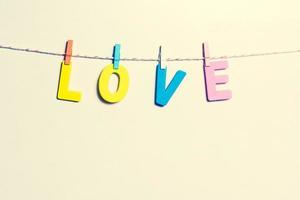 Valentines Day. Message of love with letters on pastel background photo