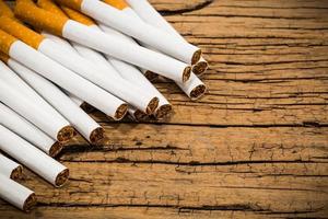 Stack of cigarette on wood table background