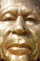 Thailand golden face buddha sculpture.