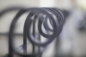 Artistic curving shape fence in shallow depth of field.