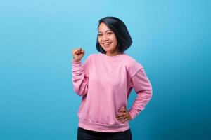Portrait of excited beautiful Asian woman photo