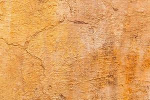 Brown adobe clay wall texture background. photo