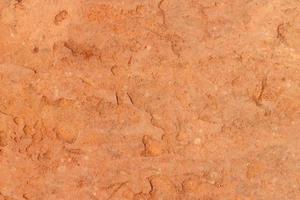 Rough red rock texture background.