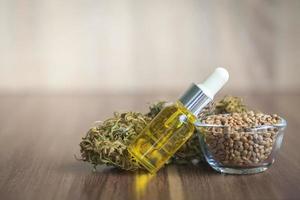 Hemp oil in the bottle and hemp seeds. photo