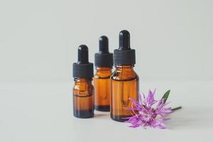 Brown glass bottles with serum, essential oil, cosmetic product