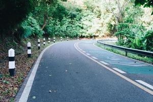 Road with bicycle lane in the country with nature surrounding. photo