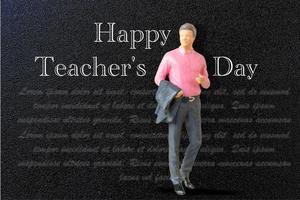 Miniature people Teacher in front of blackboard photo