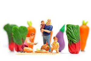 Happy family resting in vegetable farm. World Vegetarian Day concept photo