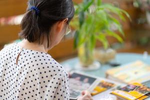 Mature woman looking at photo album