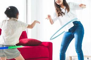 Mother and daughter hula hooping photo