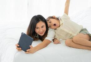 Mother and child watching a cartoon photo