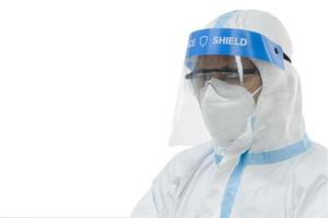 Doctor wearing PPE on white background photo