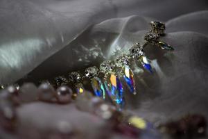 Close-up details of necklace and earrings with swarovski crystal photo