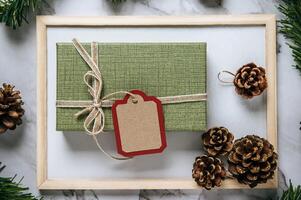 Gift boxes with small gifts on white cement photo