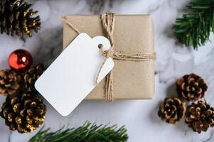 Gift boxes with small gifts on white cement photo