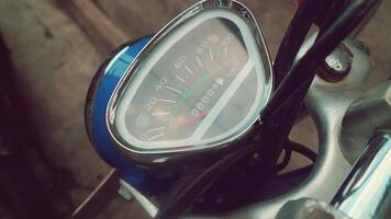 Retro speedometer of a motorcycle in blue color photo