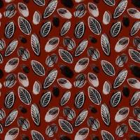 seamless pattern of fall leaves on a red background vector