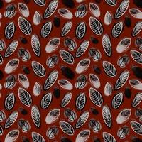 seamless pattern of fall leaves on a red background vector