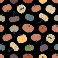 Seamless pattern of ripe pumpkins and dots on a dark background. vector