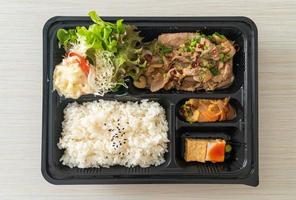 Japanese rice with pork yaki bento set photo