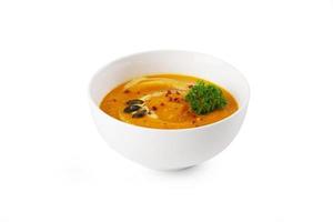 Bowl of pumpkin soup with parsley photo
