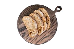 Slices of fresh rye bread on a wooden board