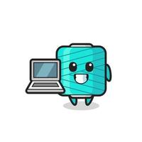 Mascot Illustration of yarn spool with a laptop vector