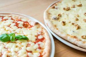 Traditional Italian pizza margherita and gorgonzola cheese and walnuts photo