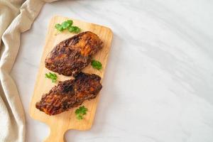 Spicy grilled Jamaican jerk chicken photo