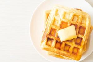 Waffle stack with butter and honey photo