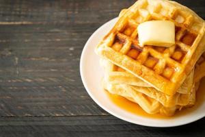 Waffle stack with butter and honey photo