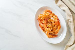 Fried shrimps or prawns with garlic photo